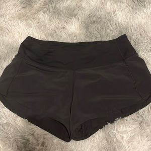 Lululemon black speed up shorts size 2. Worn but no scuffs or stains or pilling.